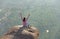 A young girl in a lotus pose is greeting the sun on a background