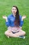 Young girl in lotus pose meditates