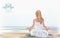Young girl in lotus position on the beach. Meditation, spiritual practice, yoga