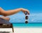 Young girl lying on a beach lounger with glasses on beach