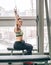 Young girl makes exercises at the gym