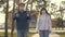 Young girl and man wear a protective mask on street, showing like. people wear medical mask for viruses, show class