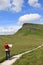 Young girl map reading on footpath to Pen-y-ghent