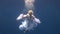 Young girl model free diver underwater white angel costume poses in Red Sea.