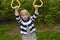 Young girl on monkey bars