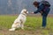 Young girl motivate her Bucovina shepherd dog