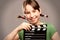 Young girl with movie clapper board