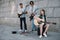 Young girl and multiracial men with musical instruments performing on sunny