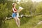 Young girl on nature with hat and map. Summer