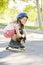 Young girl outdoors on i line skates smiling