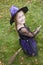 Young girl outdoors in witch costume on Halloween