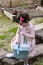 Young Girl Outside Dressed Up for Easter holding Basket