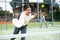 Young girl paddle tennis player performing forehand