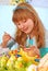 Young girl painting easter eggs