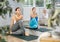 Young girl performing seated twisting asana Matsyendrasana