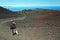 Young girl photographing volcanic landscape of Pico Vieho slope