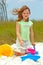 Young Girl Playing in Beach Sand