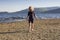 A young girl playing on the beach on a summers day