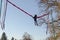 Young girl playing on the bungee trampoline outdoors in a park