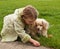 Young girl playing with a little dog