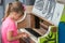 Young girl playing on the piano