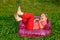 Young girl playing tricks in inflatable armchair