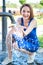 Young girl playing with water squirt and making splashes