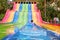 A young girl playing on a waterslide at waterpark  in Asia