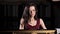 A young girl plays the piano, rehearsal before the concert. Music, classic