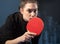 Young girl plays table tennis
