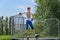 Young girl poised at the top of a skating ramp