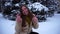 Young girl poses on winter background.