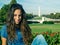 Young girl posing in front of the Ulysses S. Grant Memorial, National Mall and Washington Monument in Washington DC