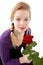 Young girl posing with red rose