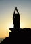 A young girl practices yoga.Sunset yoga.