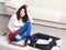 Young girl preparing her luggage before travel