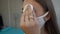 Young girl in a protective mask in a beauty salon prepares eyebrows for dyeing