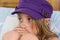 Young girl in purple hat