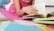 Young girl reading on the floor - closeup on hands