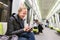 Young girl reading from mobile phone screen in metro.