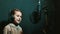 Young girl recording a song in headphones in a music recording professional studio. little girl singing a song in the