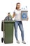 Young girl with a recycling bin and a garbage bag