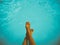 Young Girl Relaxing Her Feet At Swimming Pool