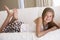 Young Girl Relaxing On Sofa At Home