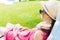 young girl resting on a wooden chair in the garden