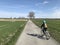 Young girl riding a bike in Polish countryside