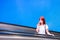 Young girl rises on escalator and talks on phone