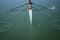 A young girl rowing in boat