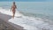 Young girl running on seashore