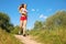 Young girl runs in forest